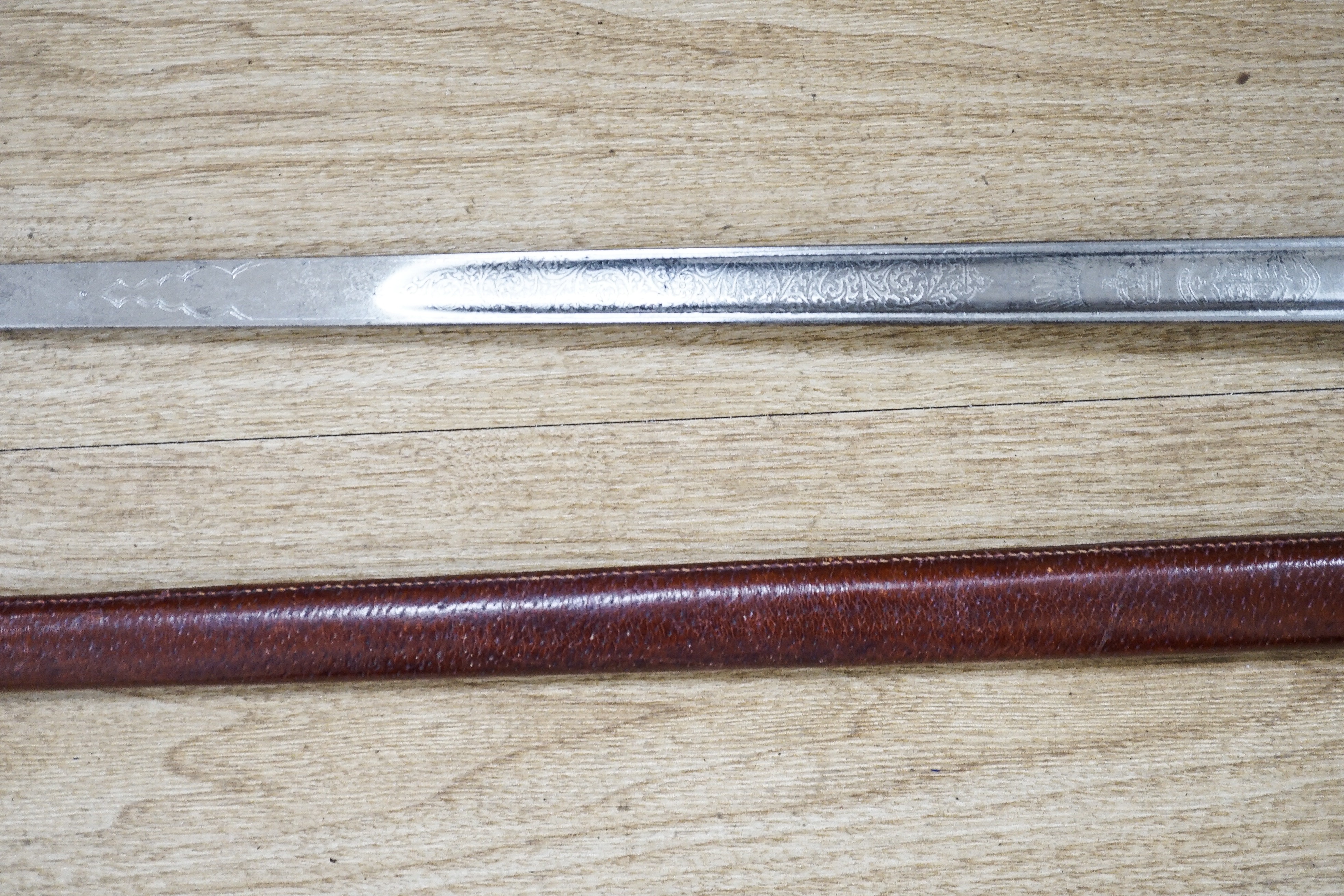 A George V Henry Wilkinson Royal Engineers dress sword with scabbard and cover, the blade etched GHL